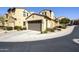 Inviting home exterior with a well-maintained lawn, two-car garage, and desert landscaping at 4777 S Fulton Ranch Blvd # 1103, Chandler, AZ 85248