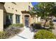 Charming home entrance with stone archway, a decorative wreath, and well-maintained landscaping at 4777 S Fulton Ranch Blvd # 1103, Chandler, AZ 85248