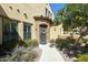 Charming home with a beautiful arched doorway, manicured landscaping, and inviting curb appeal at 4777 S Fulton Ranch Blvd # 1103, Chandler, AZ 85248