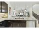 Contemporary kitchen overlooking the living room, featuring granite countertops and modern appliances at 4777 S Fulton Ranch Blvd # 1103, Chandler, AZ 85248