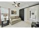 Relaxing living room featuring a comfortable sofa, side table with lamp, and modern barn door for added privacy at 4777 S Fulton Ranch Blvd # 1103, Chandler, AZ 85248