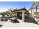 Outdoor dining area with stone columns and tile roof, providing an elegant community space to dine al fresco at 4777 S Fulton Ranch Blvd # 1103, Chandler, AZ 85248