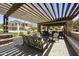 Inviting outdoor lounge area featuring comfortable seating under a pergola and brick columns in a community space at 4777 S Fulton Ranch Blvd # 1103, Chandler, AZ 85248