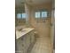 Clean bathroom featuring white cabinets and tiled floors at 511 W Ocotillo Rd, Phoenix, AZ 85013