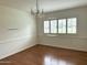 Elegant dining room with chandelier and hardwood flooring at 511 W Ocotillo Rd, Phoenix, AZ 85013