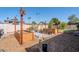 Backyard featuring a lush garden, raised beds, and decorative elements at 516 E Gemini Dr, Tempe, AZ 85283