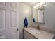 Bathroom featuring a vanity with granite countertop and modern fixtures at 516 E Gemini Dr, Tempe, AZ 85283