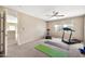 Spacious workout area includes a fan, access to a separate room, and fitness essentials for a healthy lifestyle at 6523 S 34Th Dr, Phoenix, AZ 85041