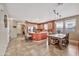 Open-concept kitchen with tile flooring, a stainless steel refrigerator, and a breakfast bar at 6523 S 34Th Dr, Phoenix, AZ 85041