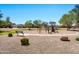 Community playground featuring swings and climbing equipment in a well maintained common area at 6523 S 34Th Dr, Phoenix, AZ 85041