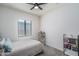 Cozy bedroom featuring a book shelf and soft natural light at 7250 N 80Th Ln, Glendale, AZ 85303