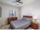 Comfortable bedroom with a ceiling fan and natural wood furniture at 7250 N 80Th Ln, Glendale, AZ 85303