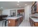 Open concept kitchen with modern island and stainless appliances, great for entertaining and open to the living area at 7250 N 80Th Ln, Glendale, AZ 85303