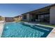 Relaxing pool with waterfall feature, hot tub, and beautiful landscaping at 7250 N 80Th Ln, Glendale, AZ 85303