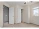 Bedroom showcasing closet, a standard door, carpet, and a window for a bright and welcoming atmosphere at 833 W Cholla St, Casa Grande, AZ 85122