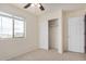 Comfortable bedroom featuring a closet, standard door, carpet, and a window for pleasant natural light at 833 W Cholla St, Casa Grande, AZ 85122