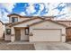 Charming two-story home with a large two car garage, neutral color scheme and low maintenance gravel yard at 833 W Cholla St, Casa Grande, AZ 85122