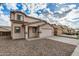 Charming two-story home with a large two car garage, neutral color scheme and low maintenance gravel yard at 833 W Cholla St, Casa Grande, AZ 85122