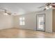 Spacious living room featuring laminate flooring, bright natural light, and ceiling fans at 833 W Cholla St, Casa Grande, AZ 85122