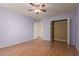 Bedroom offers a ceiling fan, closet, and natural light at 9231 N 111Th Ave, Sun City, AZ 85351