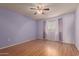 Bedroom includes a ceiling fan, light, and good natural light at 9231 N 111Th Ave, Sun City, AZ 85351