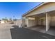 Assigned carport for parking, along with front door access to the home at 9231 N 111Th Ave, Sun City, AZ 85351