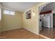 Cozy dining space with wood flooring, easy access to the kitchen, and ample natural light at 9231 N 111Th Ave, Sun City, AZ 85351