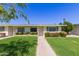 Charming single-story home with a well-manicured lawn and inviting curb appeal at 9231 N 111Th Ave, Sun City, AZ 85351