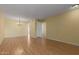 Spacious living room featuring gleaming hardwood floors, neutral walls, and modern fixtures at 9231 N 111Th Ave, Sun City, AZ 85351