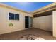 Private patio with sliding door and rock feature for low maintenance at 9231 N 111Th Ave, Sun City, AZ 85351