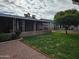 Backyard featuring a covered patio and lush greenery, perfect for relaxing outdoors at 10112 N 96Th Ave # A, Peoria, AZ 85345
