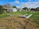 Community area with shuffleboard and grassy area and single story homes in the background at 10112 N 96Th Ave # A, Peoria, AZ 85345