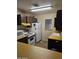 Functional kitchen featuring white appliances and ample countertop space for meal preparation at 10112 N 96Th Ave # A, Peoria, AZ 85345