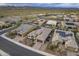 View of community with desert landscaping, tile roofs and solar panels with mountain backdrop under cloudy skies at 10246 W Oberlin Way, Peoria, AZ 85383