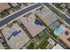 This aerial shot shows solar panels, backyards, pools, and desert landscaping in a vibrant community at 10246 W Oberlin Way, Peoria, AZ 85383
