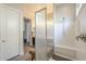 Bright bathroom features a shower with glass enclosure and a modern sink and vanity at 10246 W Oberlin Way, Peoria, AZ 85383