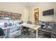 Bright craft room offers ample storage, workspace, and natural light from a window at 10246 W Oberlin Way, Peoria, AZ 85383