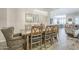 Open dining area featuring a modern chandelier and seamless flow into the kitchen and living spaces at 10246 W Oberlin Way, Peoria, AZ 85383
