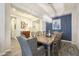 Dining room featuring a rustic wooden table with seating for eight and statement lighting at 10246 W Oberlin Way, Peoria, AZ 85383