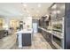 Spacious kitchen featuring stainless steel appliances, ample cabinet space, and an island with bar seating at 10246 W Oberlin Way, Peoria, AZ 85383