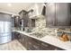 Contemporary kitchen featuring stainless steel appliances, sleek countertops, and stylish cabinetry at 10246 W Oberlin Way, Peoria, AZ 85383