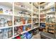 Well-stocked pantry with ample shelving for storage, maximizing organization and convenience at 10246 W Oberlin Way, Peoria, AZ 85383