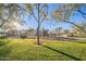 A community playground with a grassy field, mature trees, and fun play structures for entertainment at 10246 W Oberlin Way, Peoria, AZ 85383