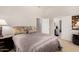 Cozy bedroom featuring warm tones and an open doorway to the en suite at 11336 N 117Th Way, Scottsdale, AZ 85259