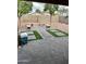 Backyard featuring hardscape and stone benches, offering a functional outdoor space at 12046 W Scotts Dr, El Mirage, AZ 85335