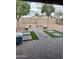 Backyard featuring hardscape and stone benches, offering a functional outdoor space at 12046 W Scotts Dr, El Mirage, AZ 85335