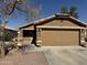 Charming single-story home with a well-maintained front yard and a two-car garage at 12046 W Scotts Dr, El Mirage, AZ 85335