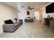 Bright and airy living room with neutral paint, lots of space, and modern furnishings at 12046 W Scotts Dr, El Mirage, AZ 85335