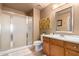 Bathroom features a glass-enclosed shower and a wood vanity at 12050 N Panorama Dr # 104, Fountain Hills, AZ 85268