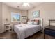 Cozy bedroom with a queen bed, neutral colors, and a window view at 12050 N Panorama Dr # 104, Fountain Hills, AZ 85268